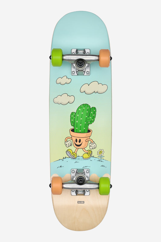 The Kids Softie Micro Complete 7.125" - Cacti Guy skateboard features a cartoon graphic of a smiling potted cactus with arms, legs, yellow shoes, walking on grass under clouds, and comes with green and orange wheels.