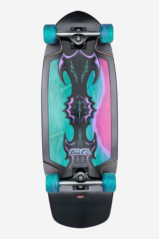 The Talon Cruiserboard 30" - Black/Blue/Green features teal wheels and a vibrant deck with an abstract design in teal, purple, and pink, plus black gothic graphics and "Talon" near the bottom.