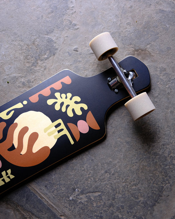 Lifestyle shot of the Geminon 37.5" Longboard Arid.