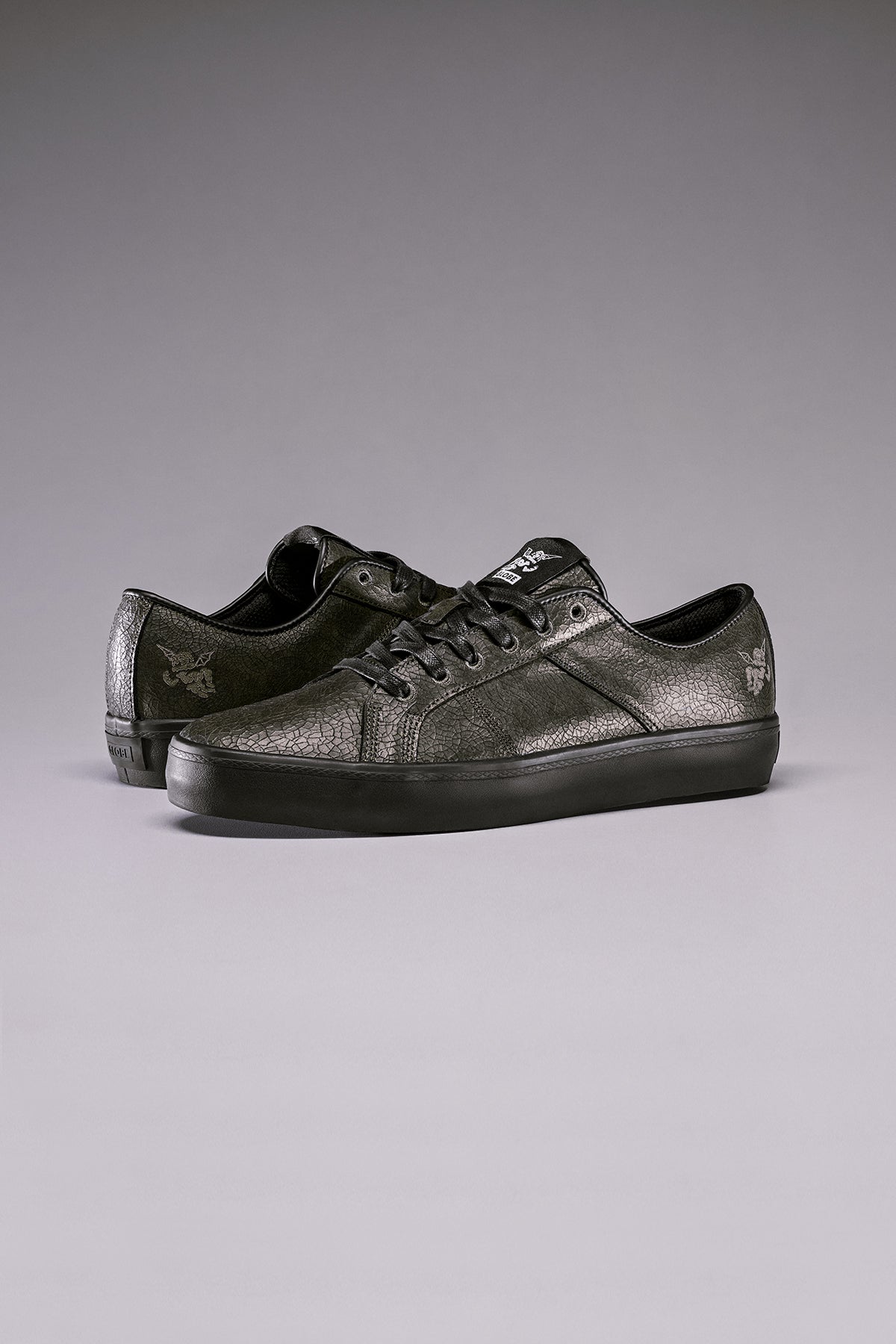 Studio image of the Surplus - Black Distress/Bauer.