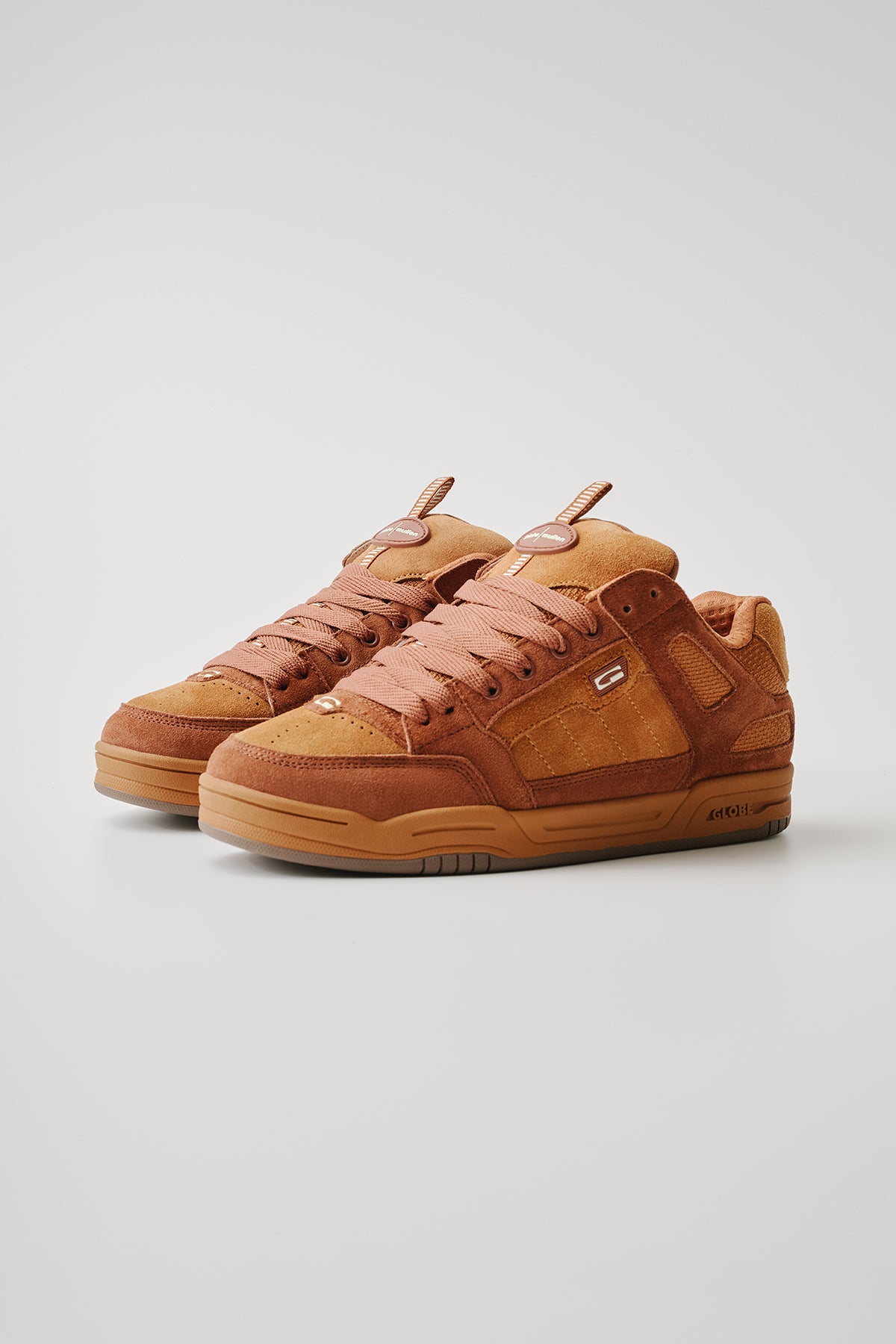 The Tilt Prime - Rust Brown / Mullen skate shoes feature brown and tan suede with gum soles, tan laces, and a small side logo—ideal for street skating—shown on a plain light gray background.