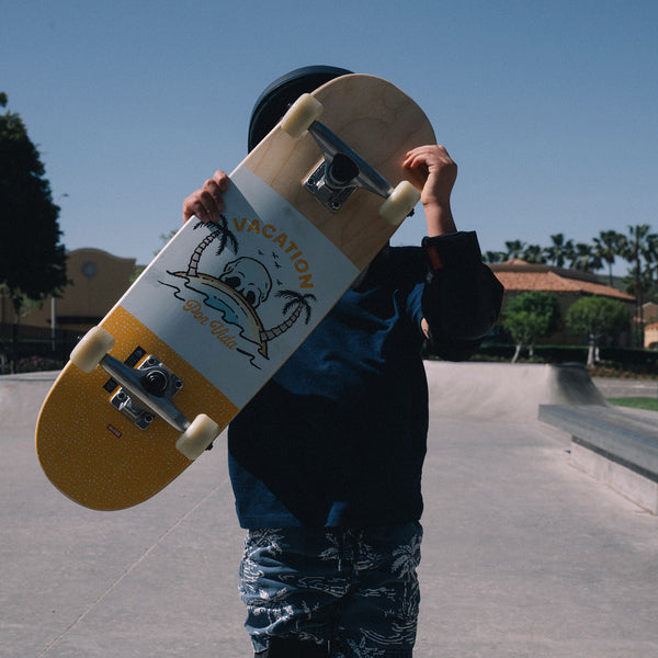 Lifestyle shot of the Kids Softie 8.0" Mini Complete Natural/Por Vida.
