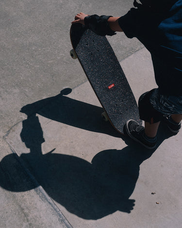 Lifestyle shot of the Kids Softie 8.0" Mini Complete Natural/Por Vida.