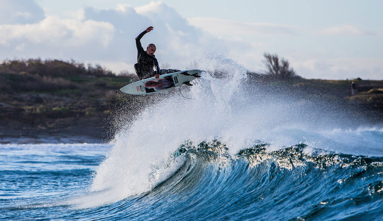 Dion Agius surfing