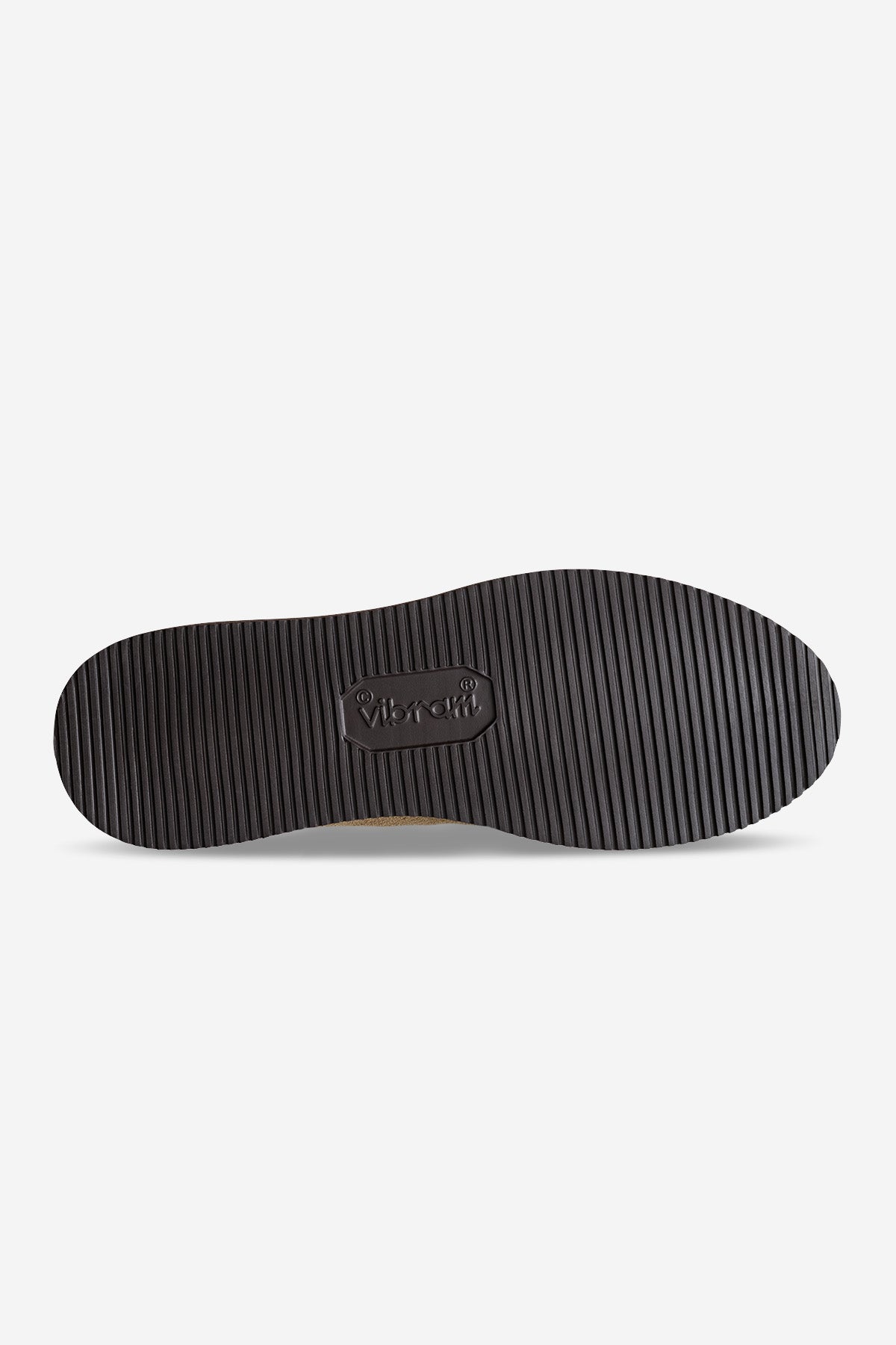 The Dover II Vibram - Taupe/MSFT features a black rubber Vibram outsole with fine horizontal grooves and an embossed logo at the center, shown from the bottom on a plain white background.