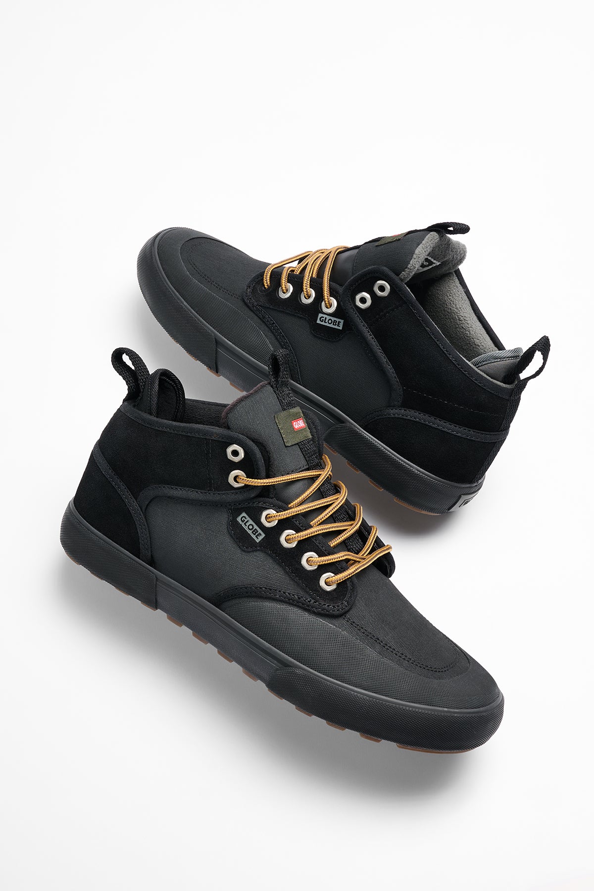 Studio image of the Motley Mid Trek Black/Gunmetal/Trek.