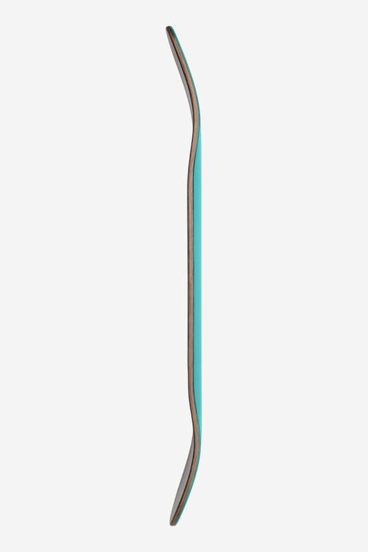 Side view of turquoise Goodstock 8.25 Waterfall deck showing layered wood core and curved edge