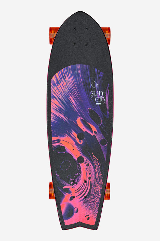 The Sun City Cruiserboard 30" - Reishi features cruiser wheels and a black Resin-7 maple deck with vibrant pink and purple abstract swirls, plus "Sun City" text in the upper right corner.