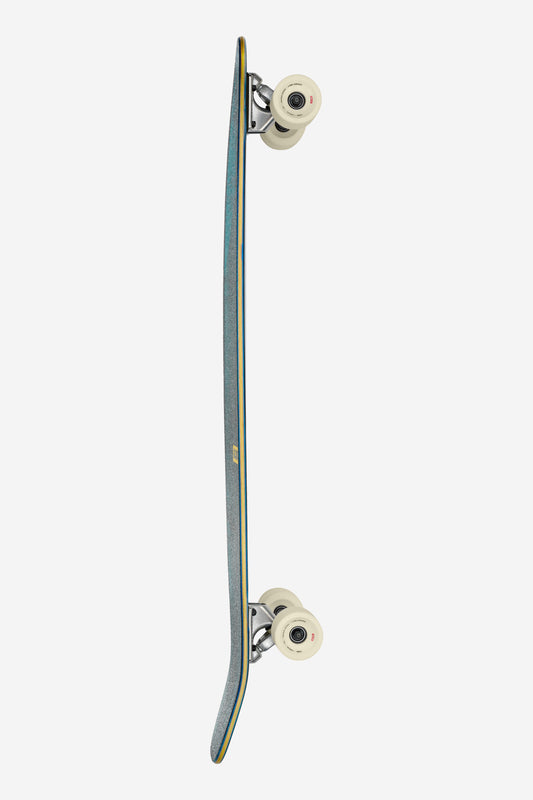 A side view of the Byron Bay Longboard 43" - Sun Days, featuring white wheels, silver trucks, and a slim blue deck against a white background.