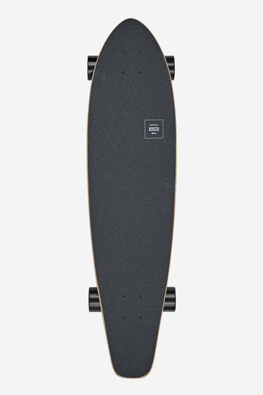 Top view of the longboard deck with black grip tape and a small white Globe logo, trucks visible along the edge
