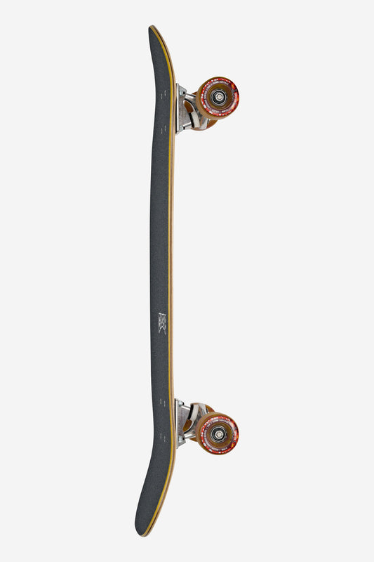 A top-down view of the Tracer Neue Cruiserboard 31" - Explorer in black with orange wheels, displayed on its side to emphasize the deck's concave shape, Tensor ATG trucks, and grip tape against a plain white background.