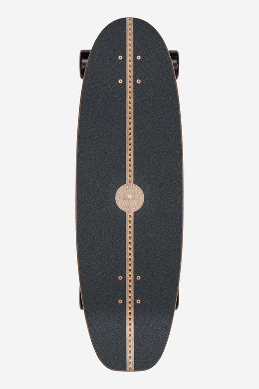 The Coaster Cruiserboard 31" - Mirage is a black skateboard featuring a wooden stripe and gear-like pattern down the center, shown from above on a white background.