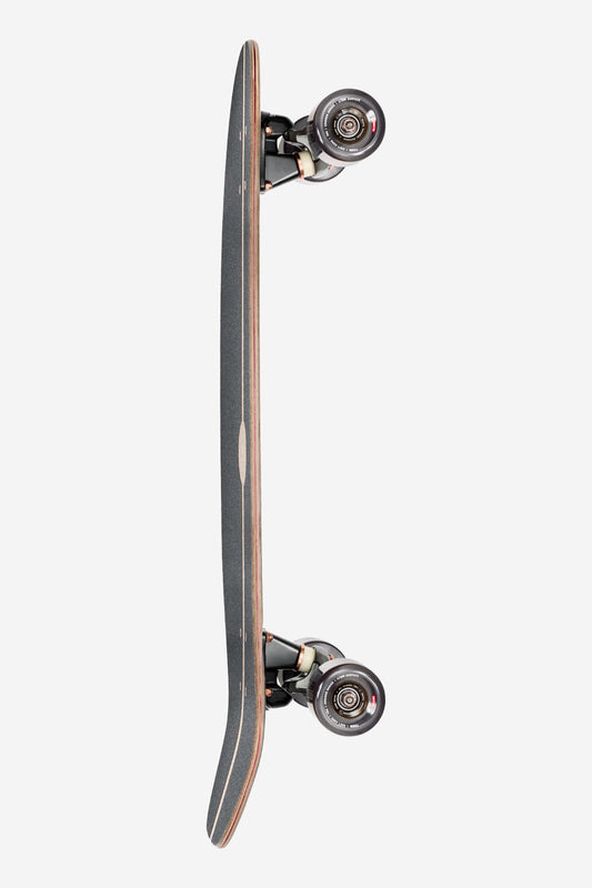 A top-down view of the Coaster Cruiserboard 31" - Mirage, featuring a black deck with wooden edges, four black wheels, and a slightly upturned tail, set against a plain white background.