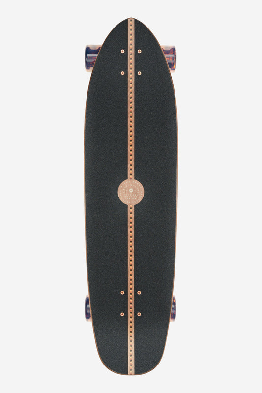 A top view of the Forager Cruiserboard 34" - Mesa, featuring black textured grip tape with a tan stripe and circular pattern down the center, plus visible truck hardware.