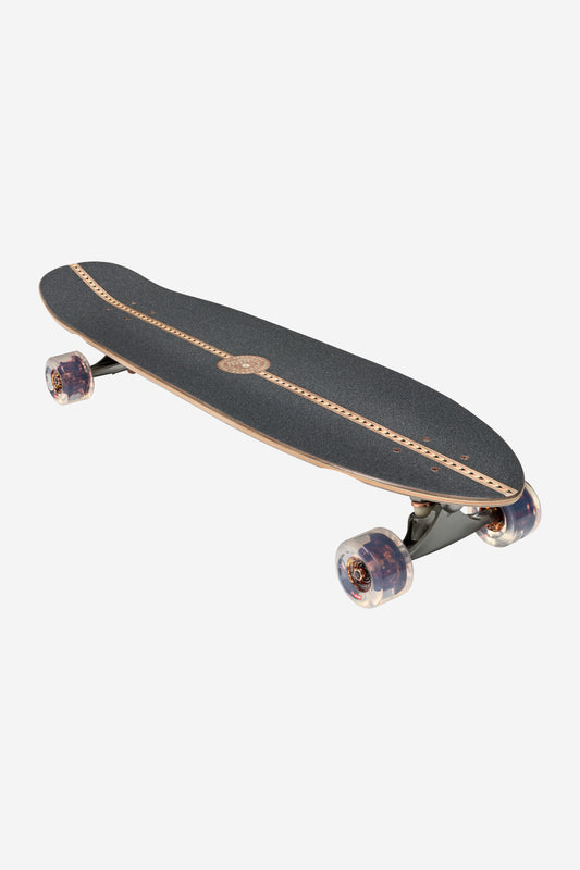 The Forager Cruiserboard 34" - Mesa features a black grip tape deck with wooden edges and a center decorative line, clear wheels, and black trucks, shown against a white background.