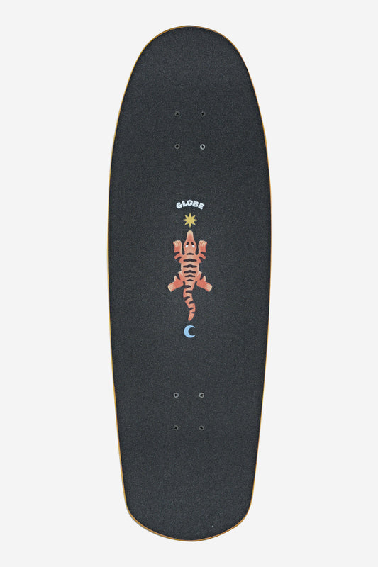 The Big Bad Bruiser Cruiserboard 33" - Lotus features black grip tape, a red lizard graphic with "Globe" above, a gold star on top, and a blue crescent moon below—all set on a crisp white deck.