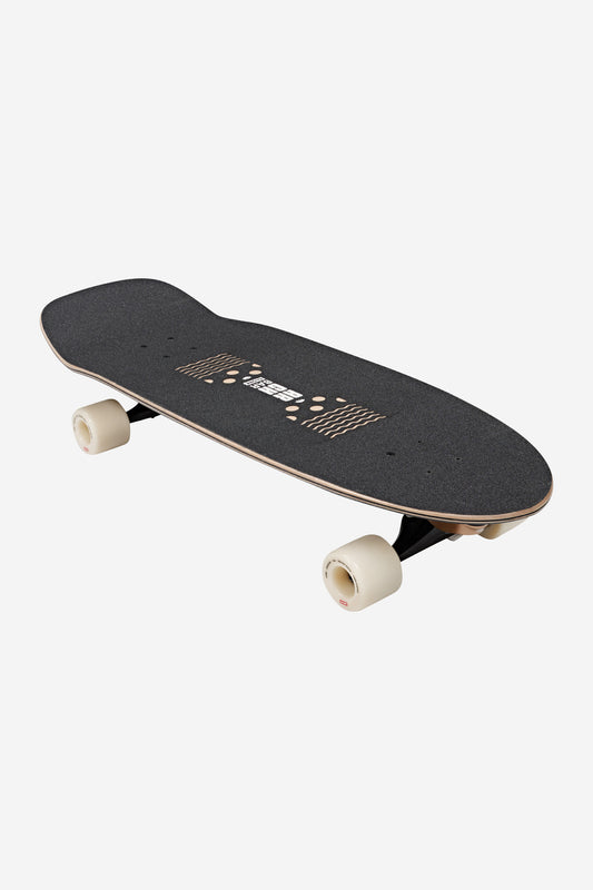 The Walrus Surf Skate Boards 31" - Black/Peaking features a black deck with textured grip tape, white wheels, cut-out patterns, and a slight curve, displayed on a plain white background.