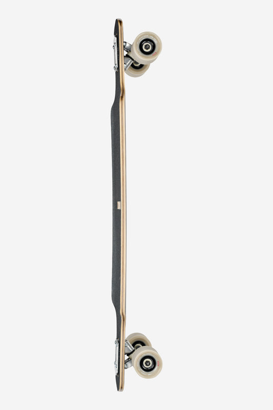 The Geminon 37.5 Longboard 38" - Arid is shown from the side, highlighting its black grip tape, curved wooden deck, and four white wheels on silver trucks, all set against a plain white background.