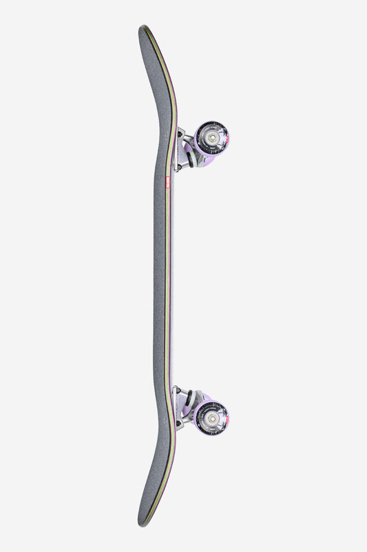 A top-down view of the G2 Reflection Complete 8.5" - Black/Purple skateboard, featuring black griptape, silver trucks, and white wheels, photographed vertically against a plain white background.