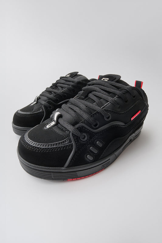 A pair of Globe CT-4 - Black Suede skate shoes with thick soles, red accents, and black laces—created in collaboration with Chet Thomas—shown on a plain light gray background.