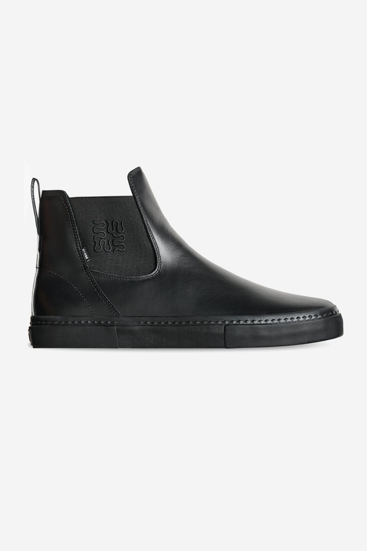 The Dover II - Wasted Talent Black/Snake is a black leather Chelsea boot with snake print accents, featuring elastic side panels, a back pull tab, and a flat rubber sole. Displayed on a plain white background.