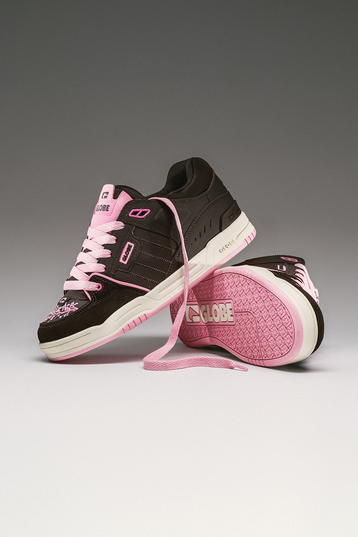 Fusion brown cherry blossom skate shoe with pink laces and white midsole, shown in a stacked pose