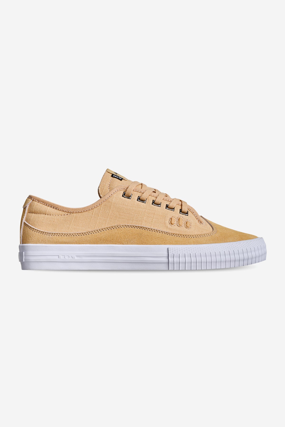 The Gillette - Khaki Linen is a tan low-top sneaker with a white rubber sole and white stitching, displayed in side profile against a plain white background.