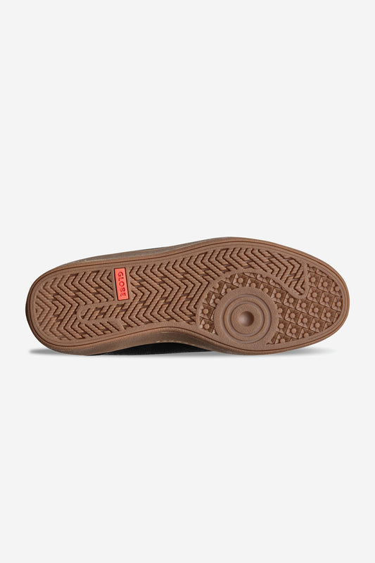 The image shows the brown rubber sole of the GS Boot, featuring textured grip patterns for traction. A small red rectangular Gola label appears near the heel, highlighting its hi-top cup-sole design.