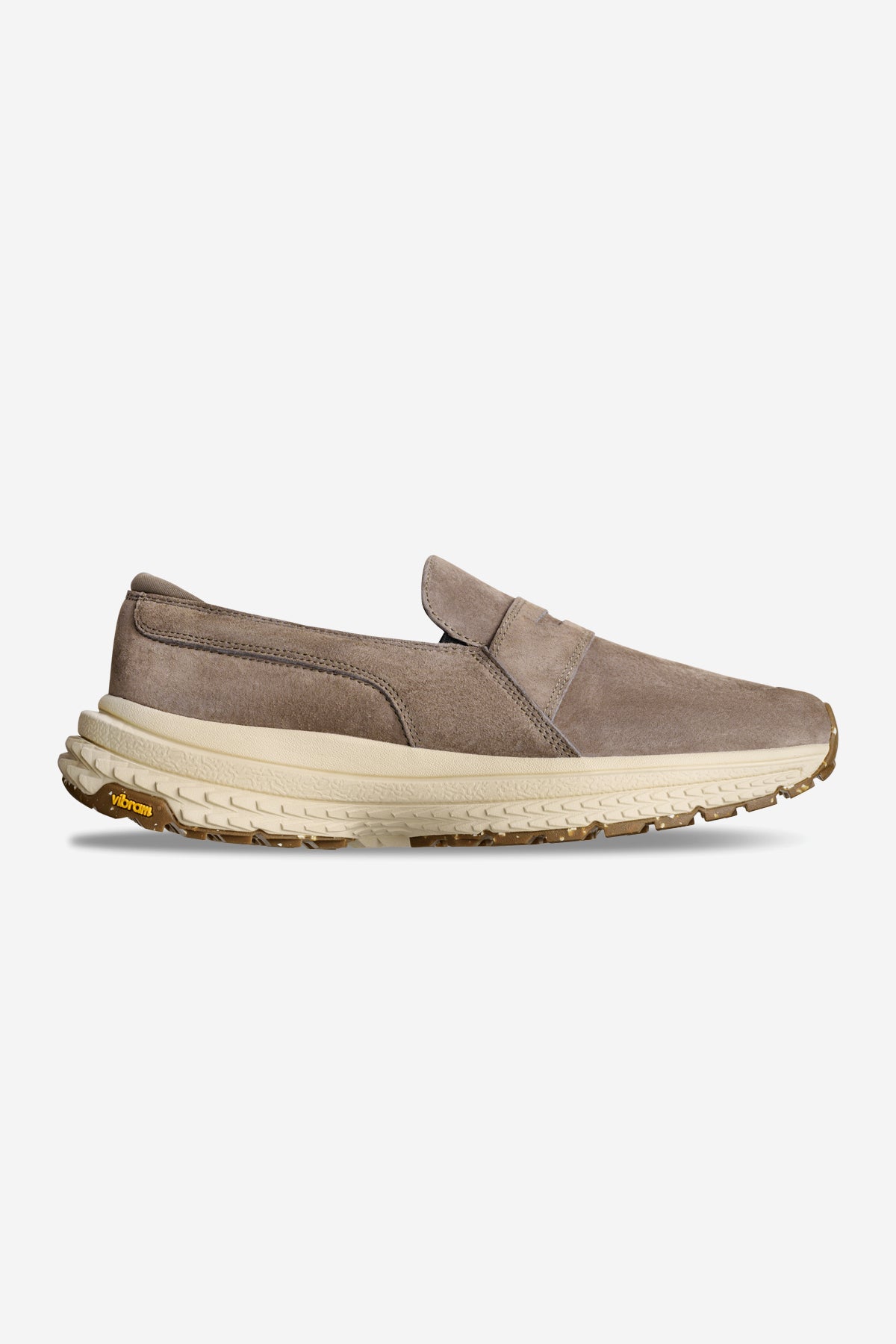 The Liaizon Vibram - Walnut is a taupe slip-on with a suede upper, cushioned beige midsole, and brown Vibram sole, shown in side profile on a white background.