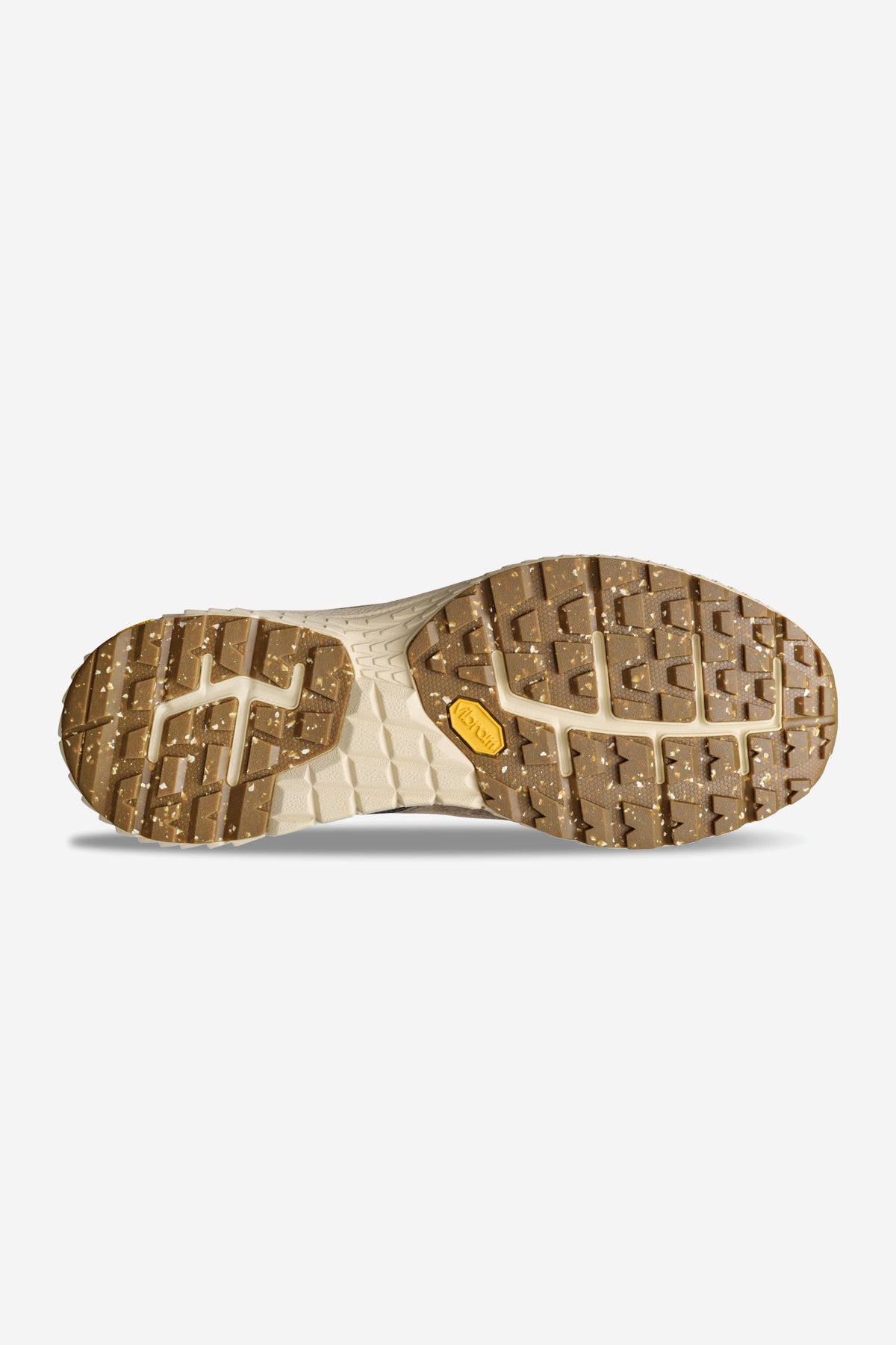 The image displays the bottom of the Liaizon Vibram - Walnut sneaker, featuring a tan and speckled brown rubber sole with a textured tread, a yellow Vibram logo near the arch, all set against a plain white background.