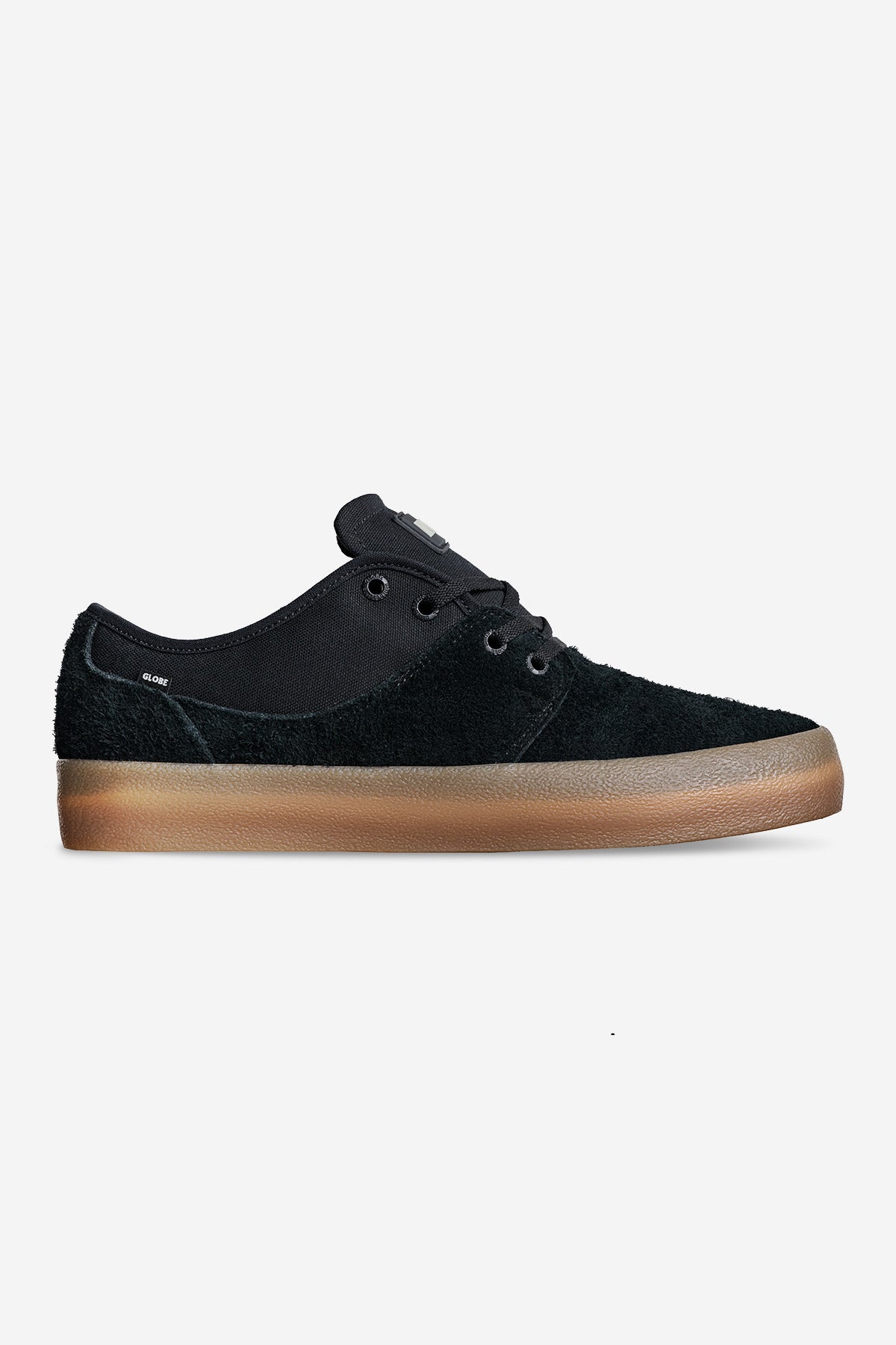 The Mahalo - Black/Gum/Crepe is a black low-top sneaker with a textured upper, black laces, and a brown rubber sole, shown on a plain white background.