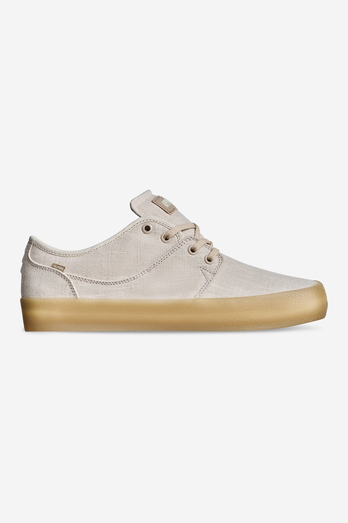 The Mahalo - Hemp/Crepe is a light beige canvas sneaker with matching laces and eyelets, featuring a light brown gum rubber sole. It’s displayed in a side profile against a plain white background.