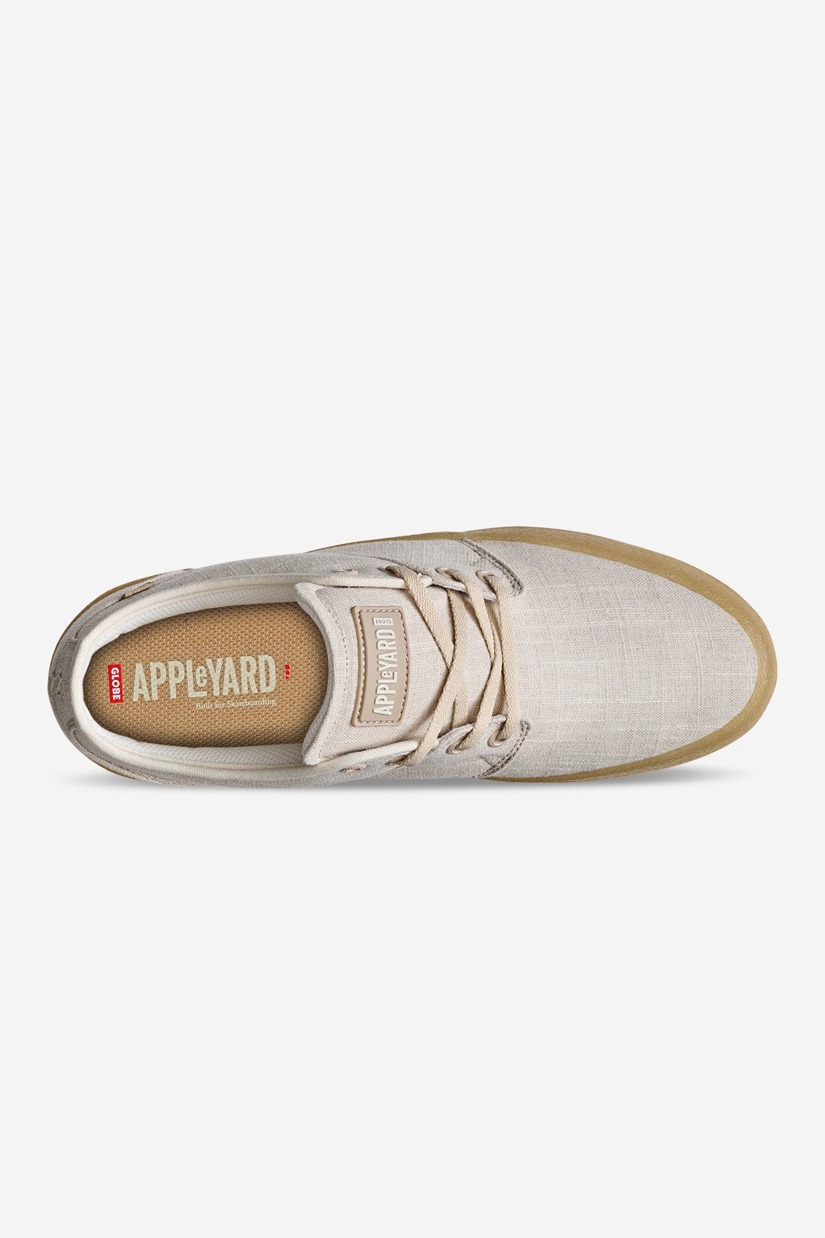 Top view of the Mahalo - Hemp/Crepe sneaker in beige with tan laces and a light brown sole. The brown insole displays "APPLEYARD" in white alongside a small red and white logo.