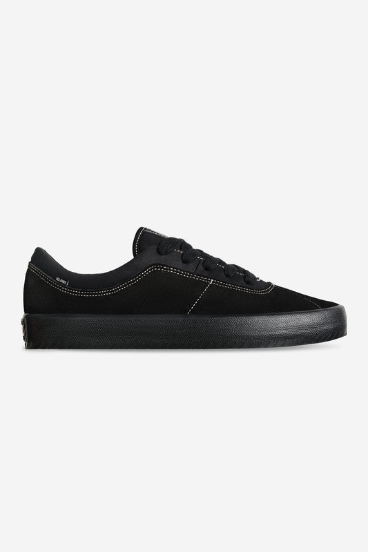 Black Melbek skate shoe with white contrast stitching and durable rubber outsole