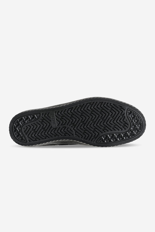 Bottom view of black Melbek sole showing herringbone tread and Globe branding