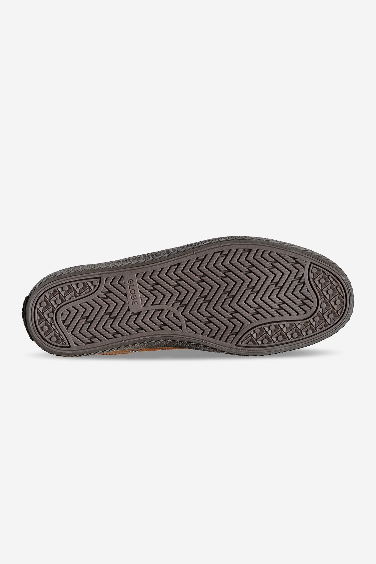 The image shows the bottom sole of the Melbek - Caramel shoe, featuring a zigzag and dotted tread pattern in dark gray with varying textures. The word Globe is visible near the center of the sole.