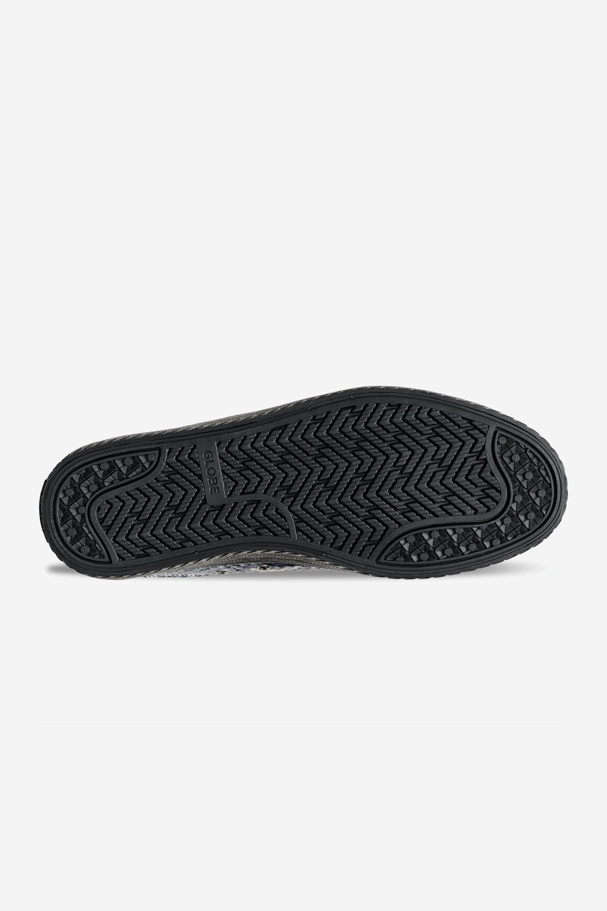 The image shows the black rubber outsole of the Melbek - Wasted Talent Black/Snake shoe, featuring a herringbone tread pattern with circular details at the toe and heel, plus the Globe brand name near the arch.
