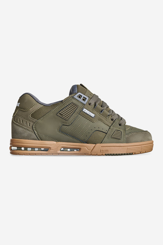 The Sabre - Moss/Gum is a single olive green skate shoe with a brown rubber sole, side stitching, mesh panels, and lace-up closure, displayed against a plain white background.