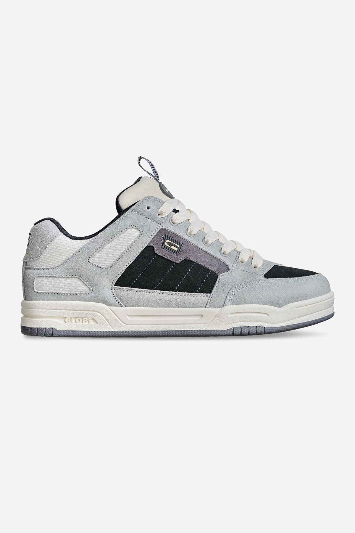 The Tilt Prime - Grey is a gray and black low-top skate shoe with white accents, a textured sole, white laces, and subtle branding on the side and tongue, shown against a plain white background.