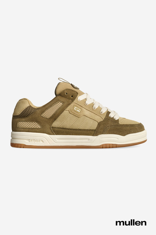 The Globe Tilt Prime in Olive/Sand/Mullen features a side profile of the tan and olive green skate shoe with a white sole and beige laces, displayed on a plain light background. "Mullen" appears at the bottom right, honoring Rodney Mullen's legacy.