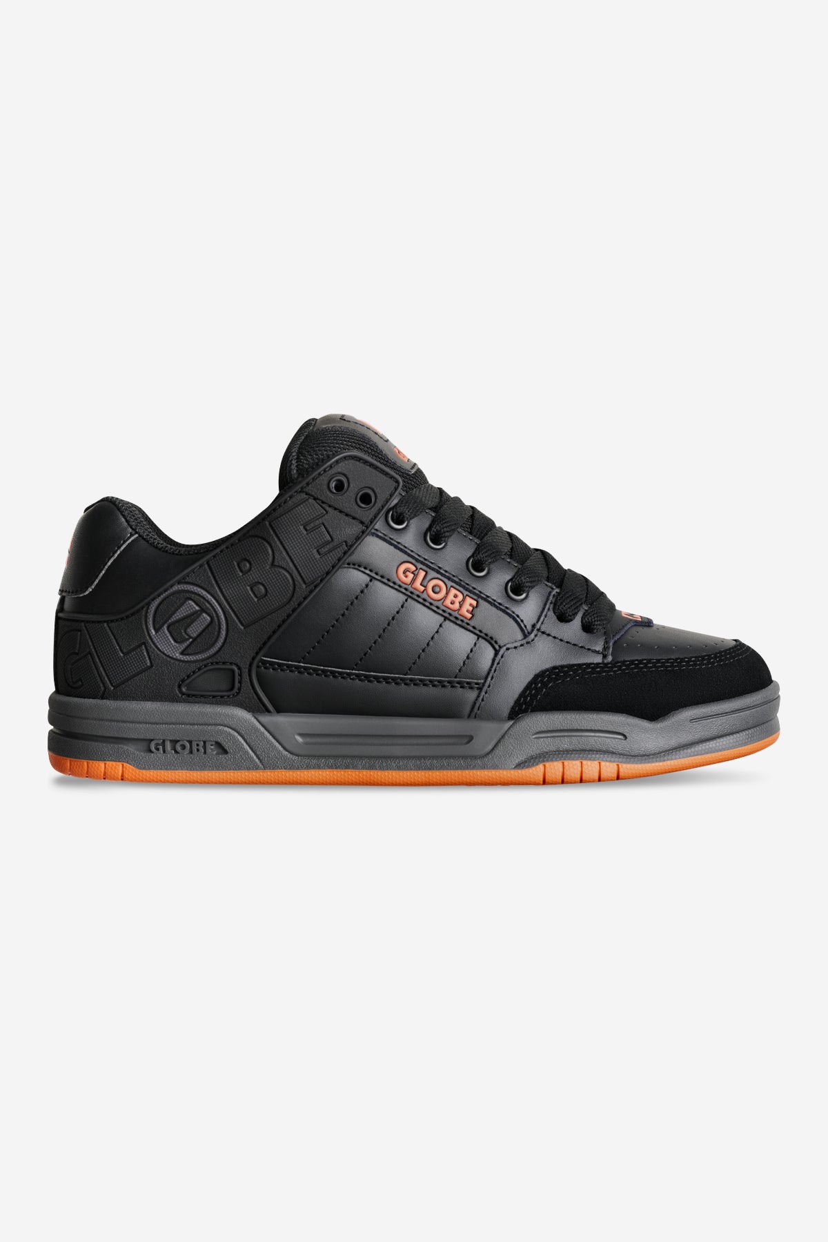 Globe Tilt skate shoe in black and orange, side view with orange outsole