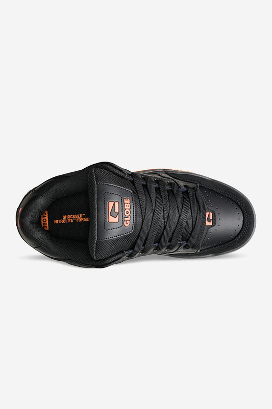 Top view of Globe Tilt black orange skate shoe with black laces and orange outsole detail