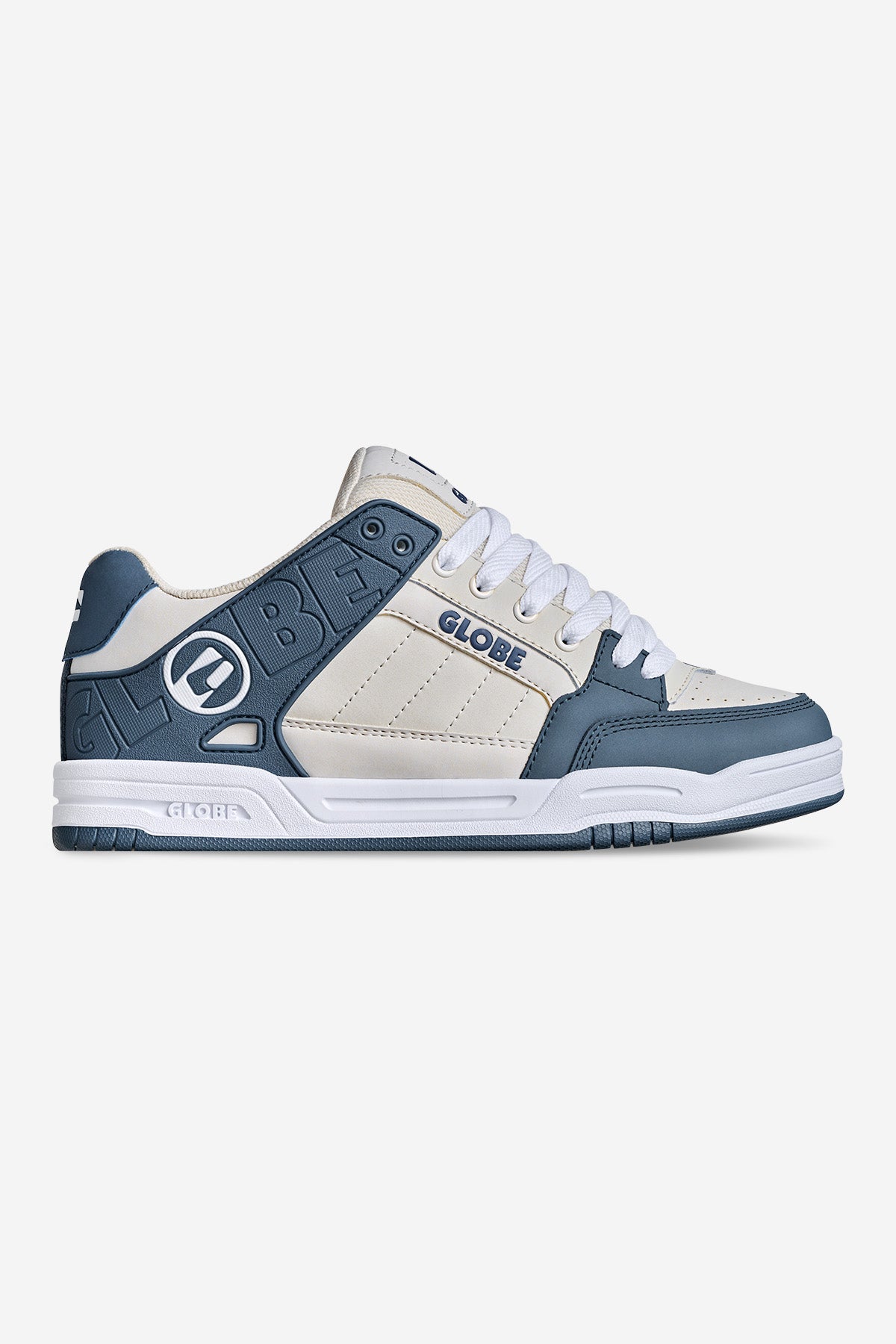 The Tilt - Blue/Grey is a low-top skate shoe with cream panels, blue overlays, white laces and midsole, plus the GLOBE logo and emblem on the side and tongue.