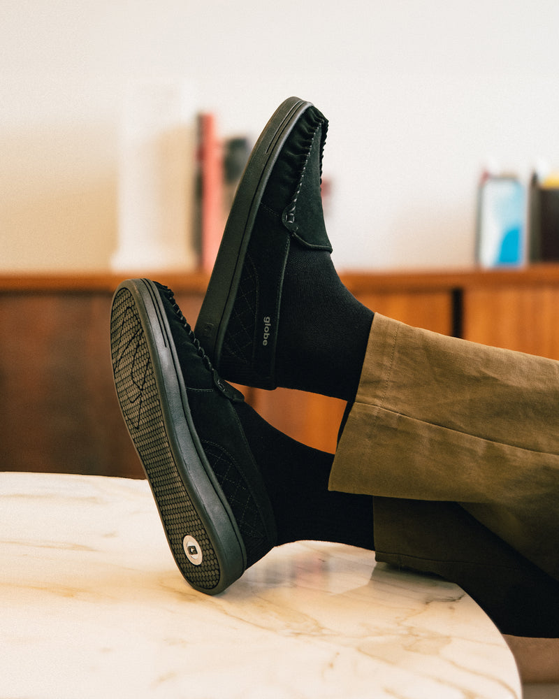 castro shoes relaxing on a table