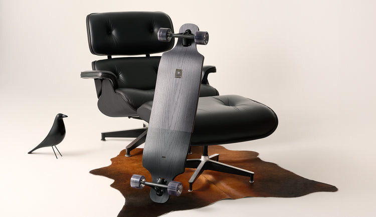 Eames chair & Eames Lounge 38" Longboard Black Oak/Black lifestyle shot