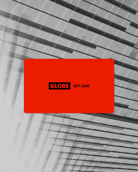 A vivid red Gift Card labeled "Gift Card" is centered against a grayscale background featuring geometric lines and glass panels from modern architecture.