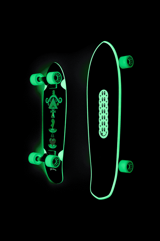 Glow in the dark Ma'at Blazer 26 inch cruiser board with neon green edges displayed on black background