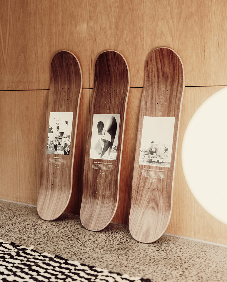 The three Eames Office x Globe Top decks leaning on a wall 