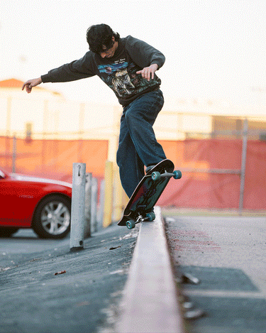 Lifestyle images of the Talon Cruiserboard 30" - Black/Blue/Green. 