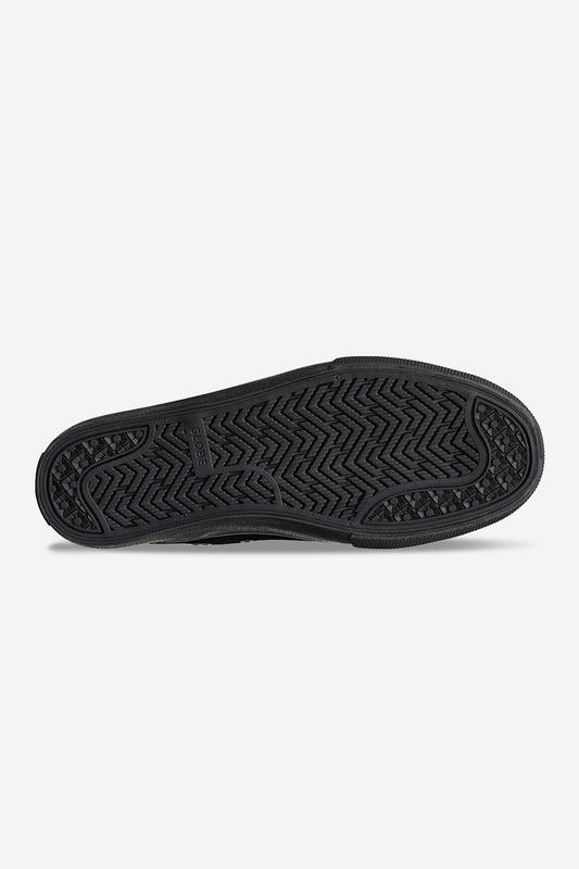 The image displays the black rubber sole of the Dover - Black Suede/Gillette sneaker, with a herringbone tread for traction and durability, and "CONVERSE" embossed in the center.